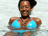 Melanie Brown flashing her big breast in bikini poolside candids