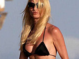 Nicollette Sheridan exposing amazing body in tiny bikini on the beach
