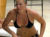 Nell McAndrew shows her ass in a sexy black bikini poolside candids