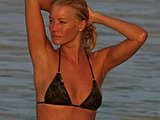 Denise Van Outen caught bathing in a tiny bikini on the beach