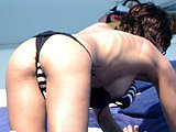 Martina Colombari flashing her nude tits and tight ass tanning topless