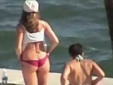 Jennifer Aniston oiling body on beach
