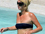 Nicky Hilton caught tanning and bathing in a tiny bikini poolside