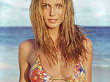Heidi Klum exposing nude boobs under body-painted bikini on the beach
