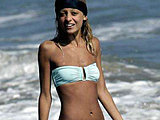 Nicole Richie shows her skinny body in a tiny bikini on the beach