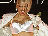 Anna Nicole Smith bodacious blonde shows her huge boobs in a silk bra