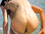 Uma Thurman Exposing Bush On A Beach