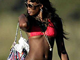 Naomi Campbell caught suntanning in a tiny red bikini candids