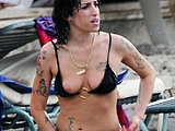 Amy Winehouse flaunting nipple slip in a tiny bikini on the beach