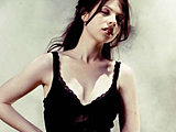 Michelle Trachtenberg looks so cute posing in a black short dress