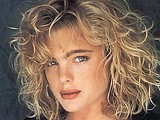 Erika Eleniak stripping topless in tight thong