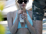 Avril Lavigne looks so sweet in a tiny blue bikini in the pool