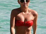 Elisha Cuthbert tiny bikini candids and bare tits sides shoots