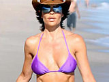 Lisa Rinna showing her tight body caught in a tiny bikini candids