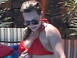 Hilary Duff caught by paparazzi in wet red bikini