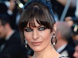 Milla Jovovich teases in sexy dress on red carpet