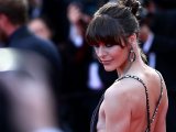 Milla Jovovich braless showing side boob in Cannes
