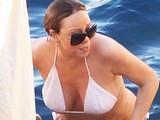 Mariah Carey showing huge cleavage in white bikini