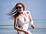 Lindsay Lohan topless and in bikini at beach